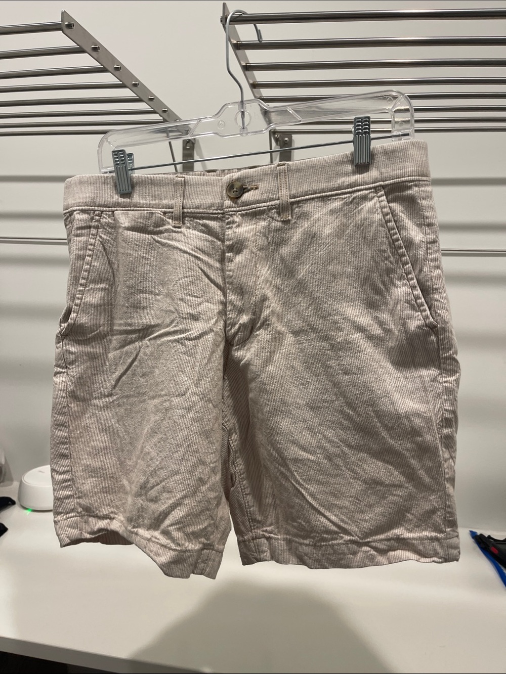 Men’s tan and white striped shorts